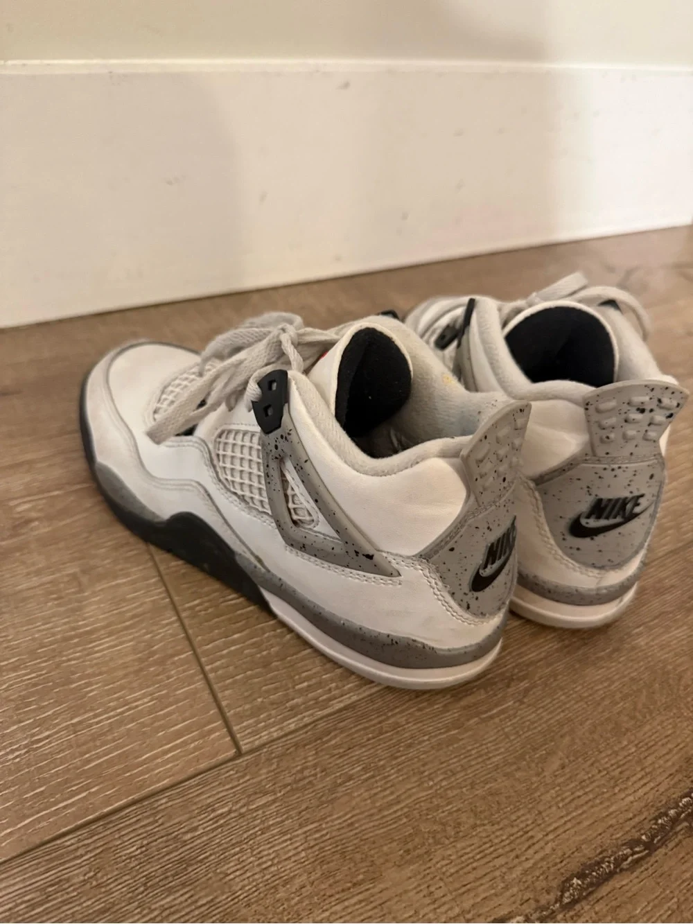 Air Jordan 4 Retro “White Oreo” in kids size 1Y.